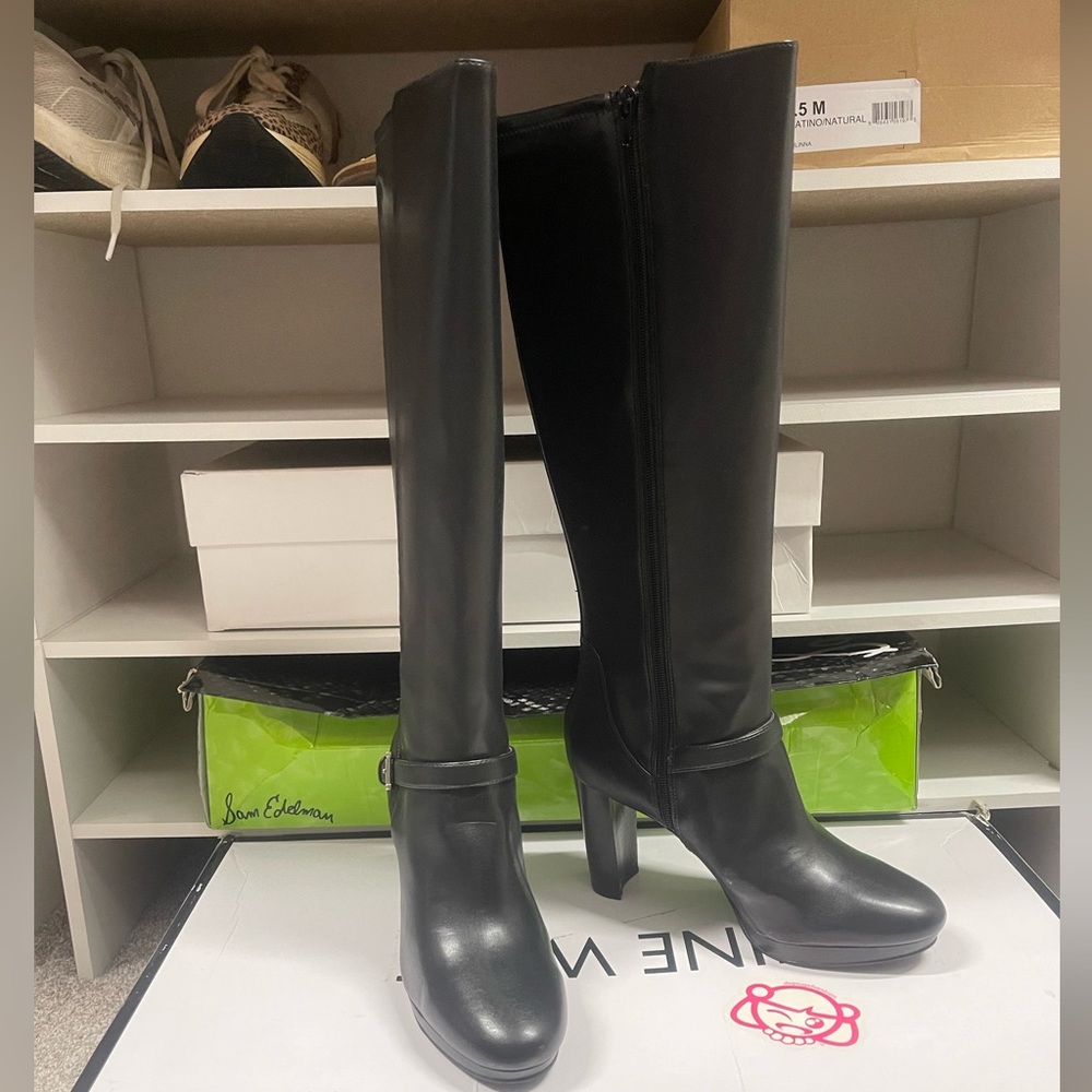 Knee High Steve Madden Full zip black leather with buckle accent.